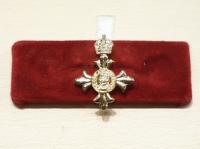 OBE lapel pin